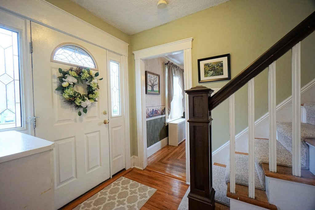 14 East Prospect Street Methuen, MA 01844 - Photo 20 of 42 a view of entryway with wooden floor and stairs