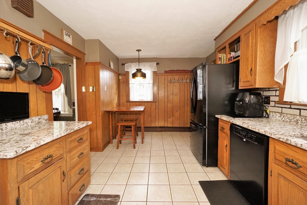 14 East Prospect Street Methuen, MA 01844 - Photo 25 of 42 a kitchen with stainless steel appliances granite countertop a sink and a cabinets