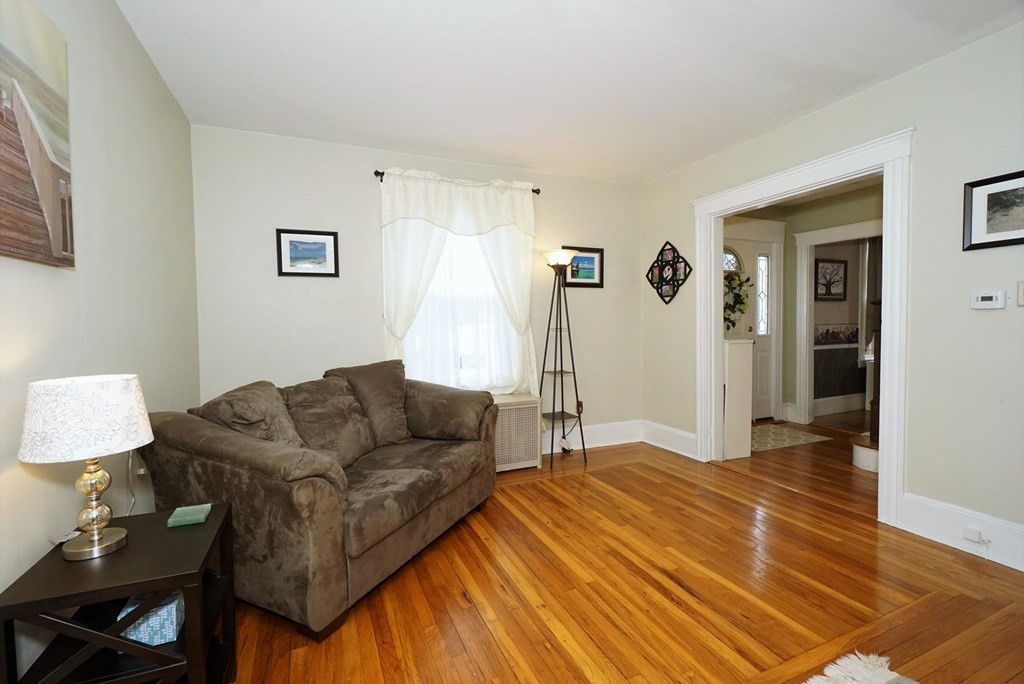 14 East Prospect Street Methuen, MA 01844 - Photo 30 of 42 a living room with furniture and a wooden floor