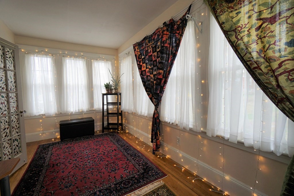 14 East Prospect Street Methuen, MA 01844 - Photo 32 of 42 a living room with a couch and a large window