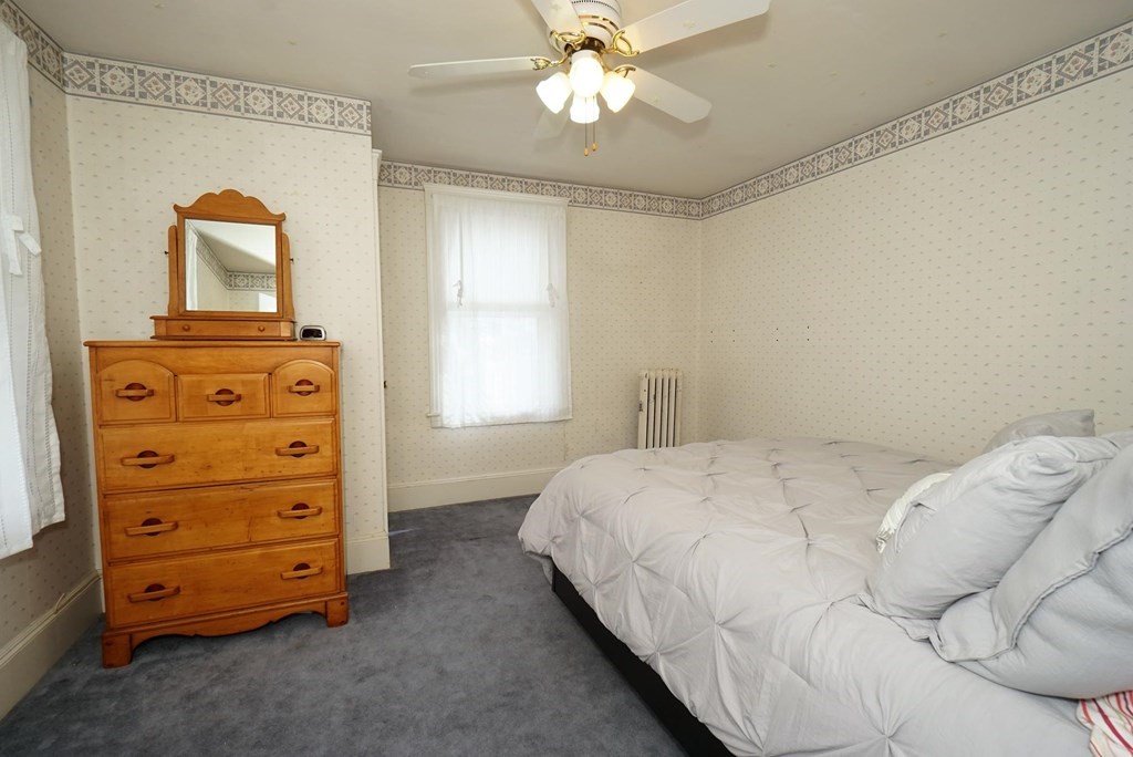 14 East Prospect Street Methuen, MA 01844 - Photo 35 of 42 a bedroom with a bed and a dresser
