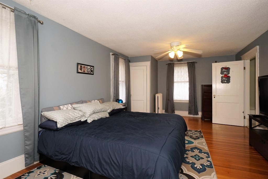 14 East Prospect Street Methuen, MA 01844 - Photo 37 of 42 a bed sitting in a spacious bedroom next to a window