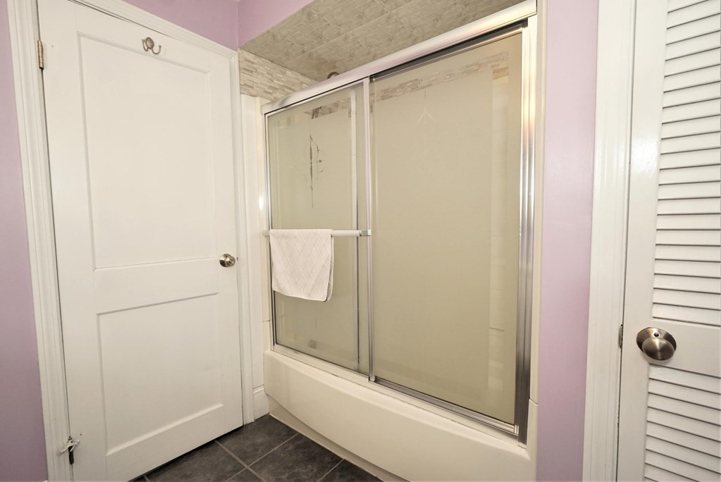 14 East Prospect Street Methuen, MA 01844 - Photo 39 of 42 a bathroom with a glass shower door