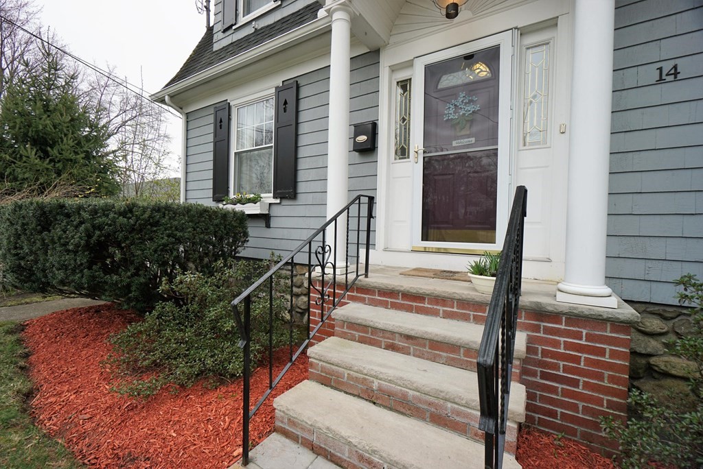 14 East Prospect Street Methuen, MA 01844 - Photo 6 of 42 a front view of a house with a yard