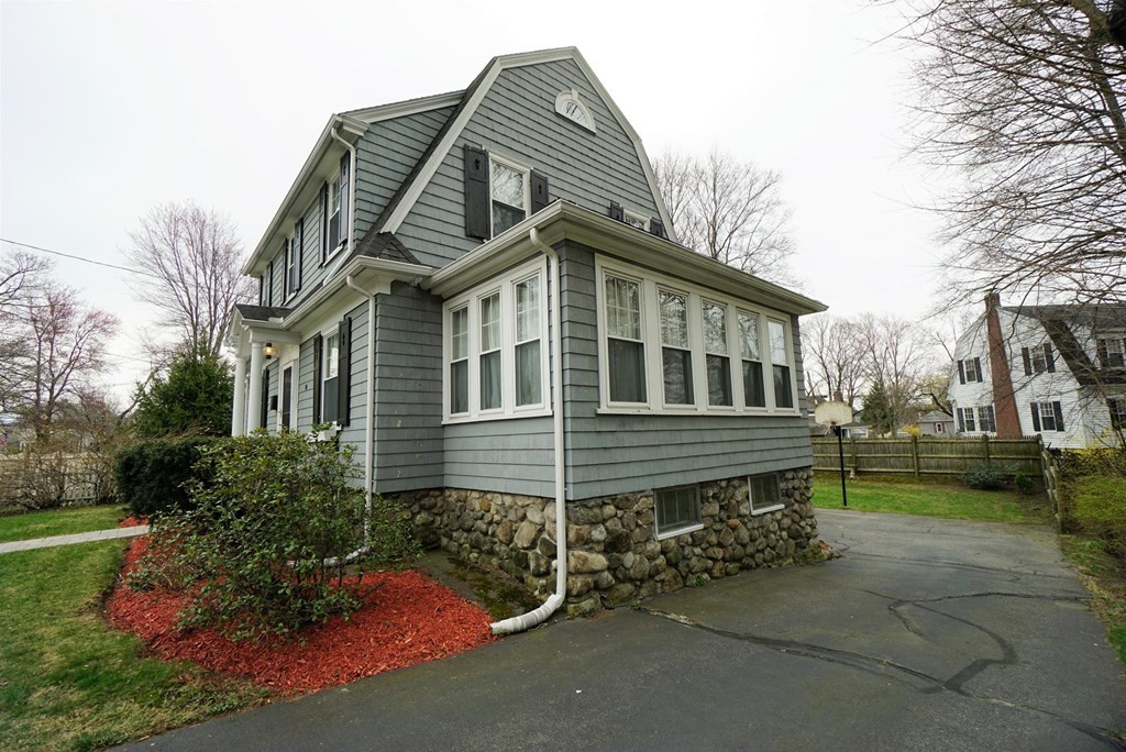 14 East Prospect Street Methuen, MA 01844 - Photo 7 of 42 a front view of a house with a garden