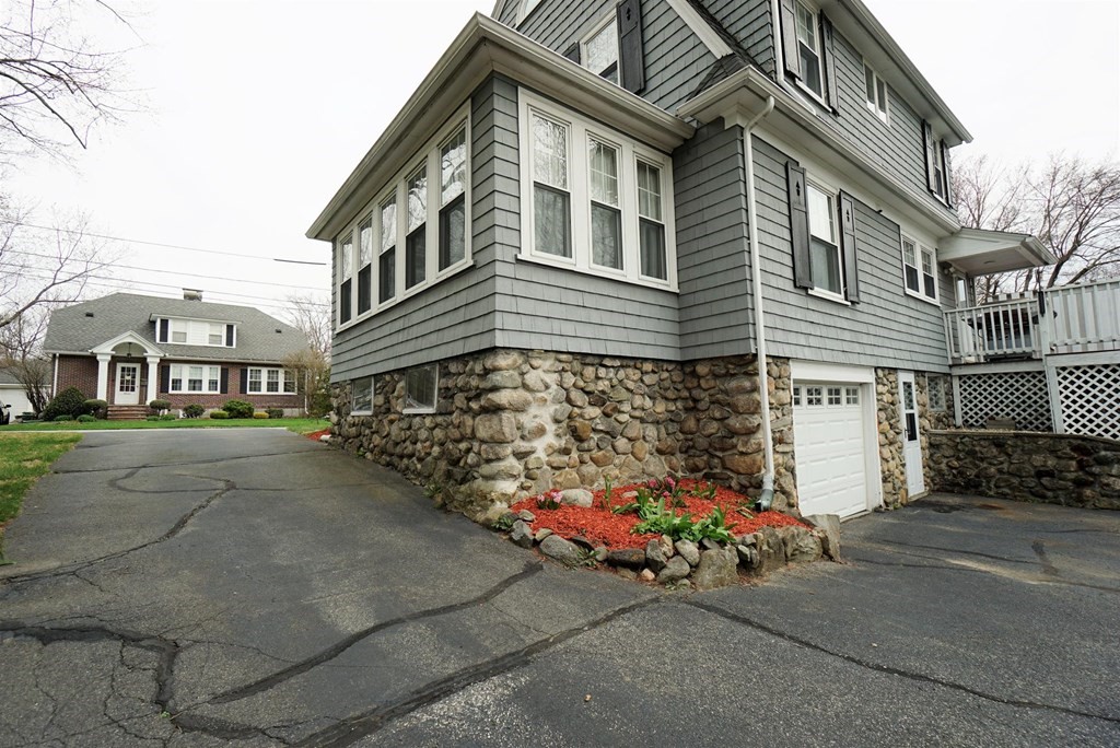14 East Prospect Street Methuen, MA 01844 - Photo 8 of 42 a front view of a house with a yard