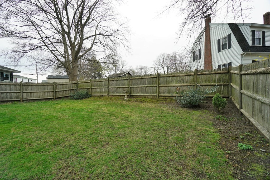 14 East Prospect Street Methuen, MA 01844 - Photo 10 of 42 a view of a yard with wooden fence