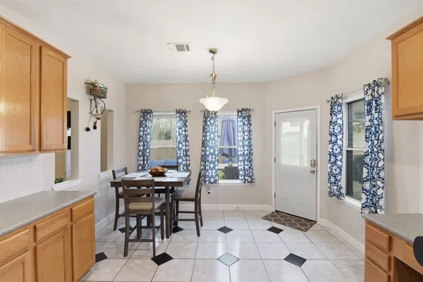 a dining room with furniture and window