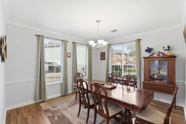 a view of a dining room with furniture window and outside view