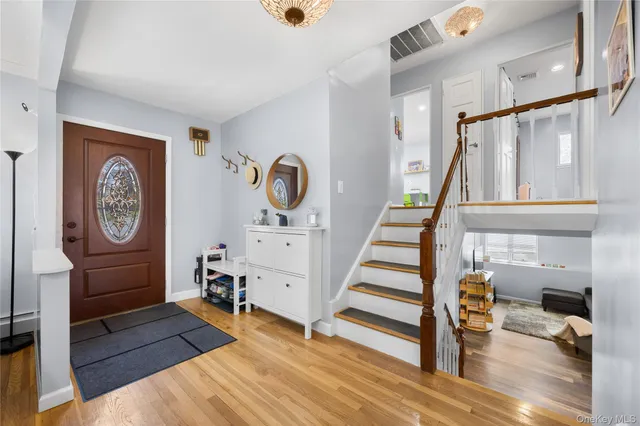 a view of entryway with stairs and furniture