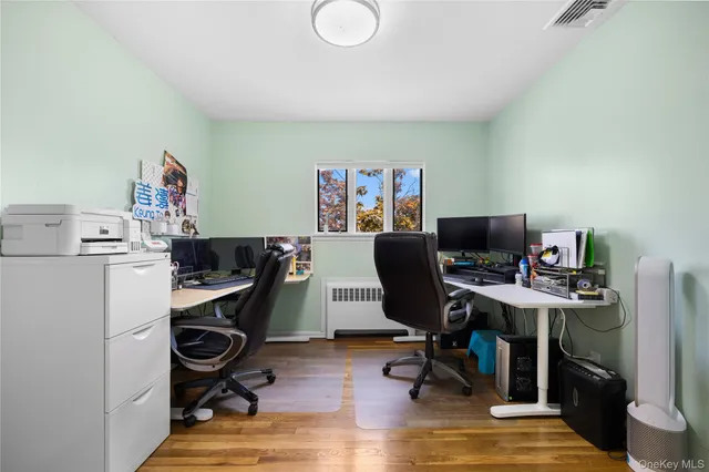 a view of a workspace with furniture and a workspace