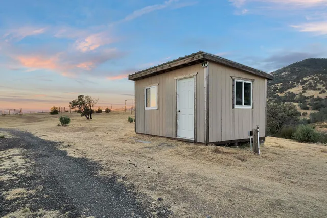 a terrace with outdoor seating and city view
