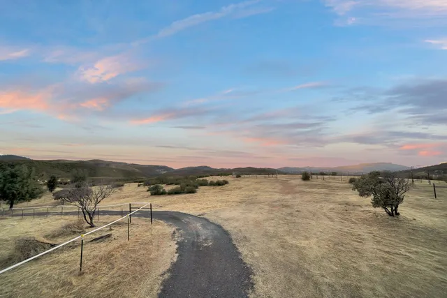 a view of a livingroom with furniture and a bathroom