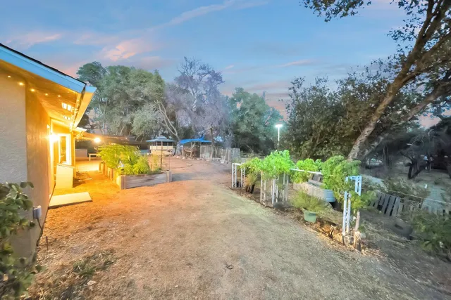 a front view of a house with outdoor seating