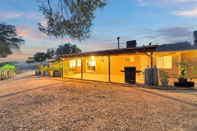 a view of a hallway with furniture and windows