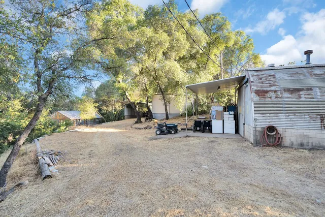 a living room with furniture a couch and paintings on the wall