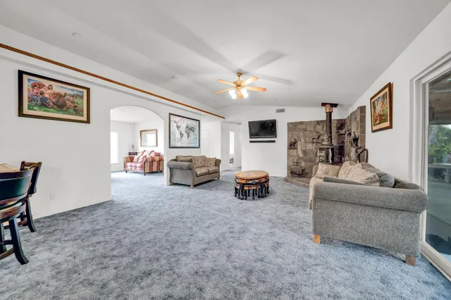 a view of a barn with a large tree