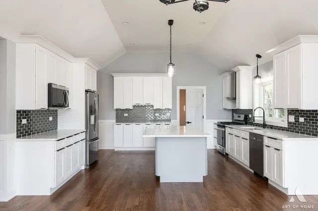 a view of wooden floor and windows in a room