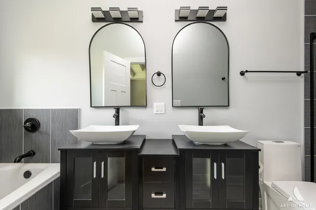 a bathroom with a bathtub and a sink