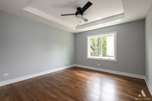 a view of a room with wooden floor and a sink
