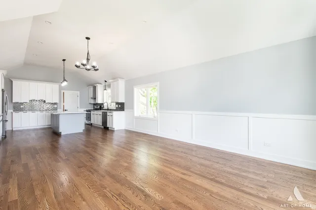 a view of empty room with a fireplace
