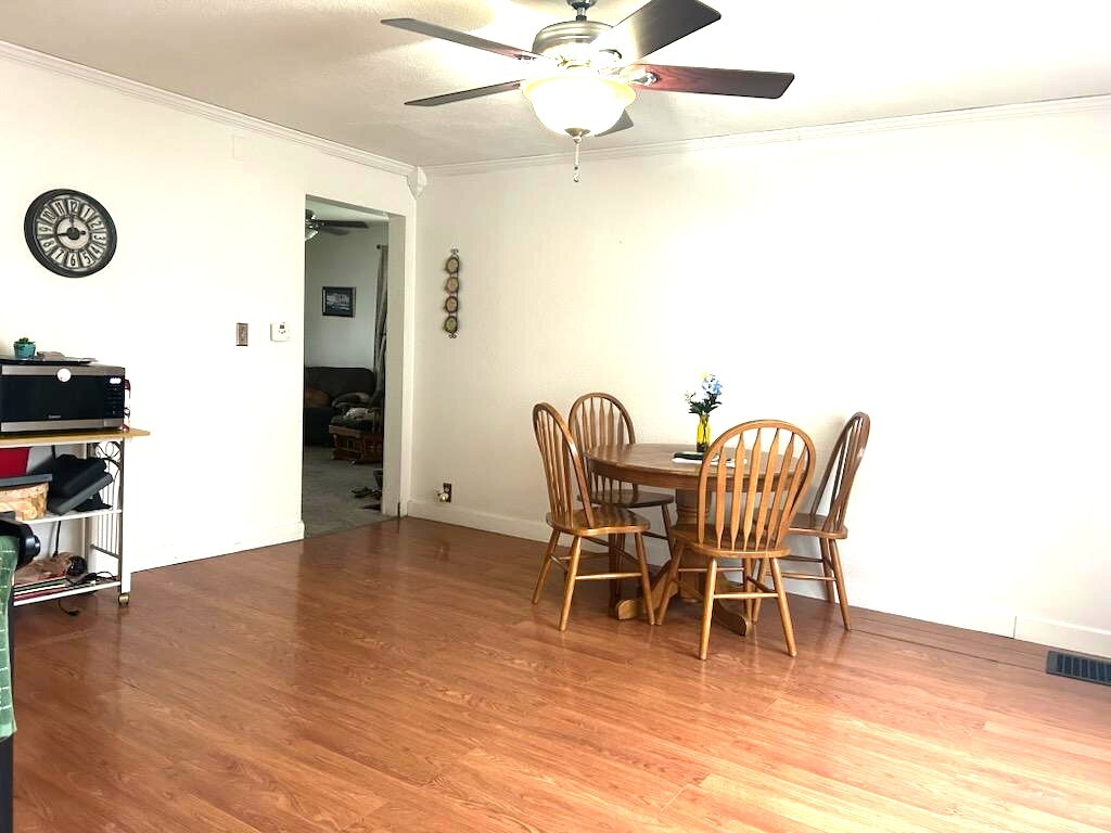 504 11th Avenue Mendota, IL 61342 - Photo 8 of 15 a dining room with furniture and wooden floor