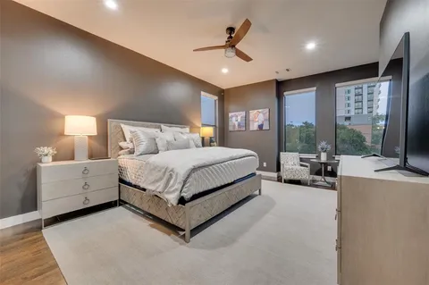 a bed room with a bed and a large window