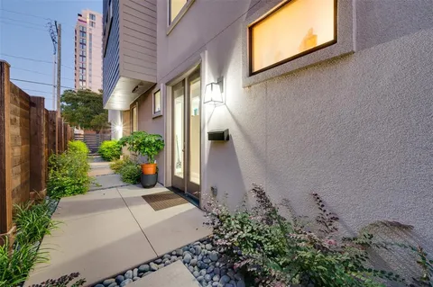 a view of a pathway both side of house