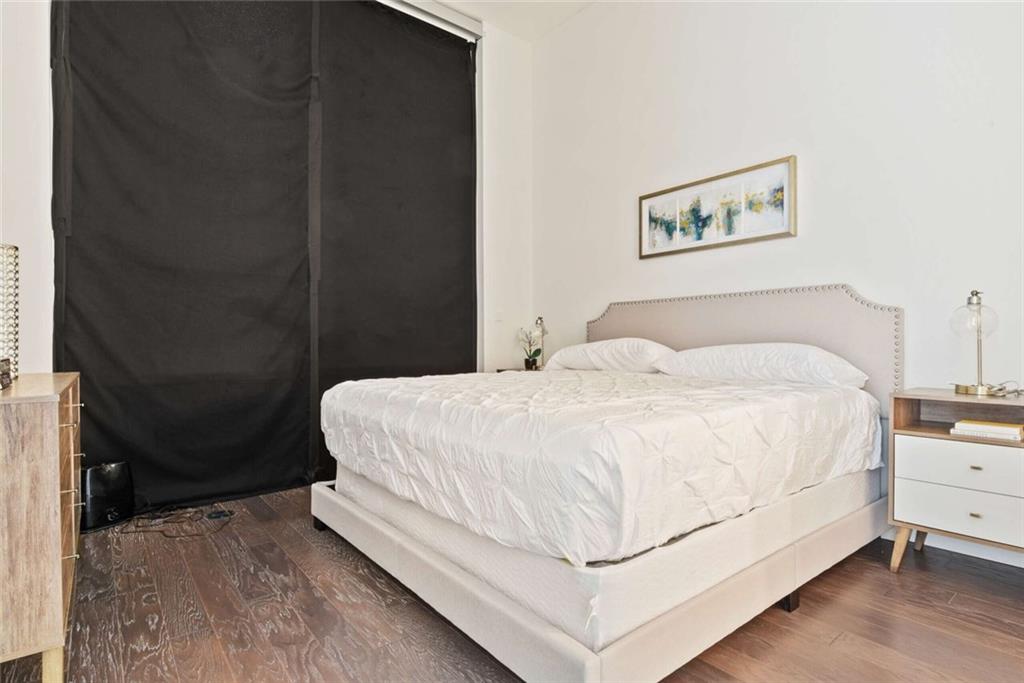 205 12th Street Northeast, Unit 3 Atlanta, GA 30309 - Photo 15 of 24 a bedroom with a bed and a window
