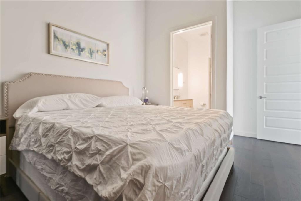 205 12th Street Northeast, Unit 3 Atlanta, GA 30309 - Photo 16 of 24 a large white bed in a white room