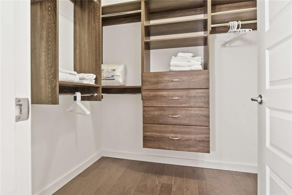 205 12th Street Northeast, Unit 3 Atlanta, GA 30309 - Photo 19 of 24 a view of walk in closet with empty racks