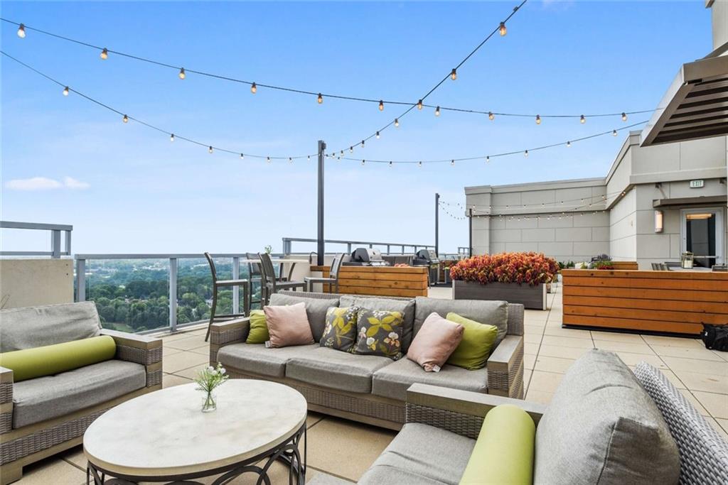 205 12th Street Northeast, Unit 3 Atlanta, GA 30309 - Photo 22 of 24 a balcony with furniture and a couch