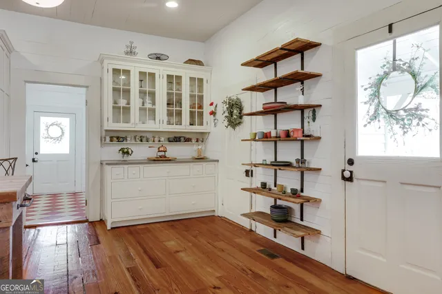 a kitchen with stainless steel appliances refrigerator and cabinets