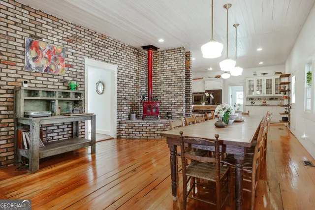 a kitchen with refrigerator and microwave
