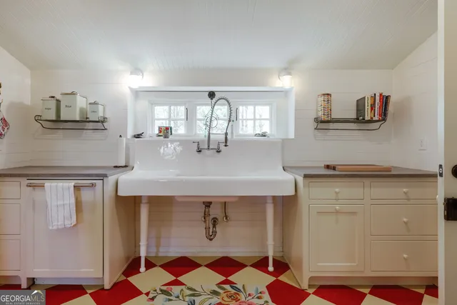a bathroom with a sink a toilet and a bathtub