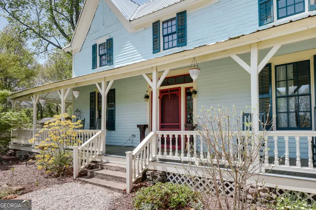a living room with fireplace furniture and a flat screen tv