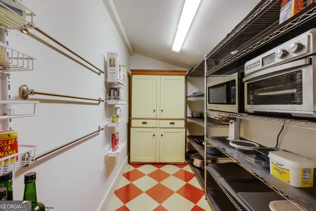a white toilet sitting next to a bathroom sink