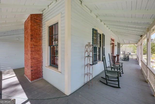 a kitchen with stainless steel appliances kitchen island granite countertop a stove a sink and a cabinets