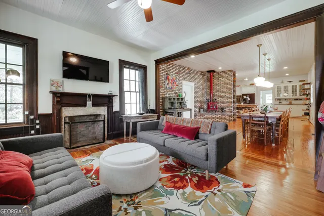 a living room with furniture and a rug