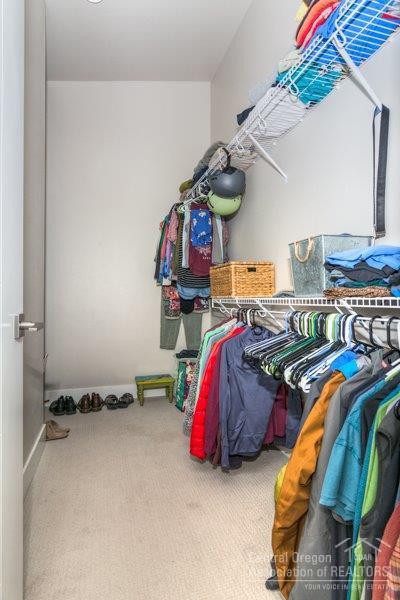 62013 Dantili Road Bend, OR 97701 - Photo 14 of 25 a view of walk in closet with clothes and shoes