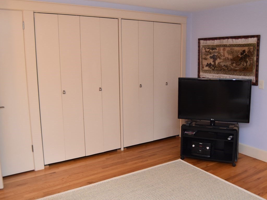 32 Aubinwood Road Amherst, MA 01002 - Photo 24 of 42 a living room with furniture and flat screen tv