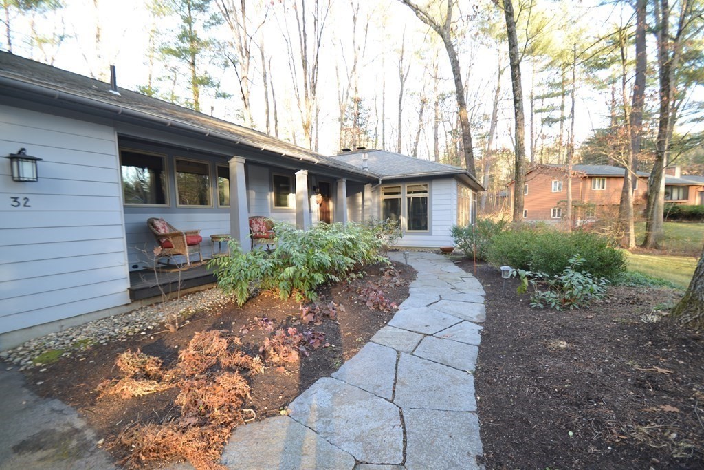 32 Aubinwood Road Amherst, MA 01002 - Photo 3 of 42 a front view of a house with garden