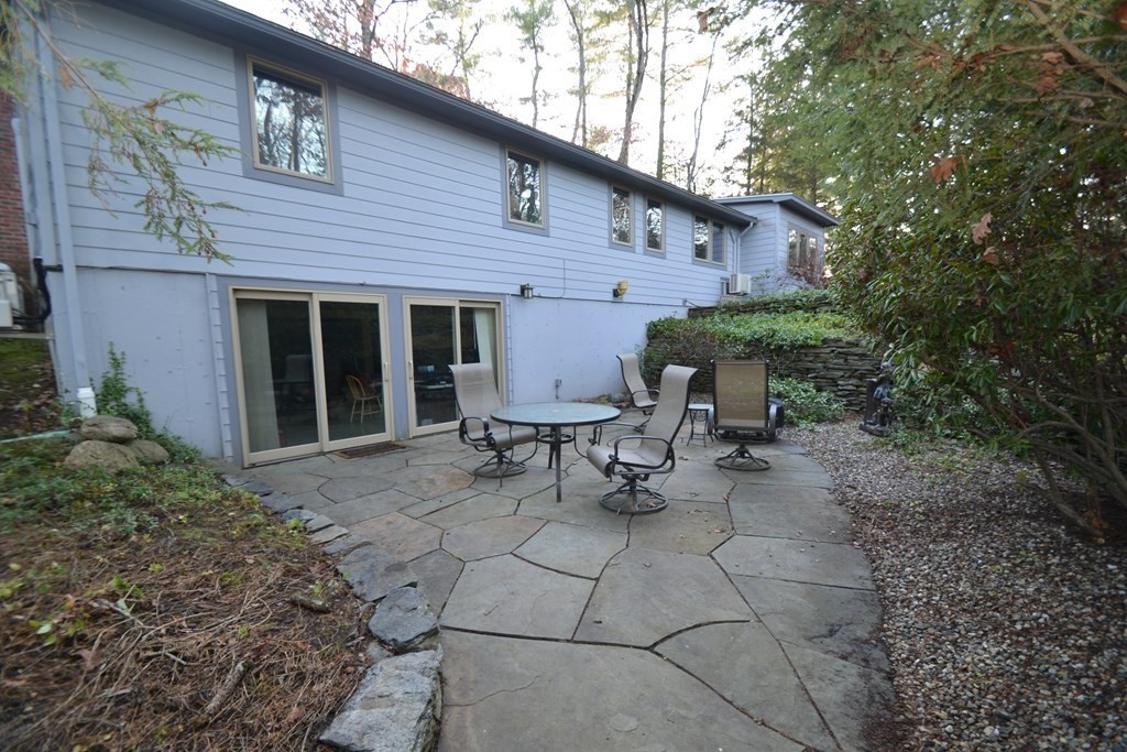 32 Aubinwood Road Amherst, MA 01002 - Photo 42 of 42 a view of a patio with table and chairs and potted plants