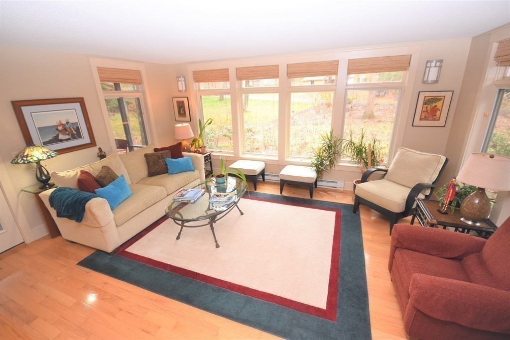 32 Aubinwood Road Amherst, MA 01002 - Photo 5 of 42 a living room with furniture large window and a table