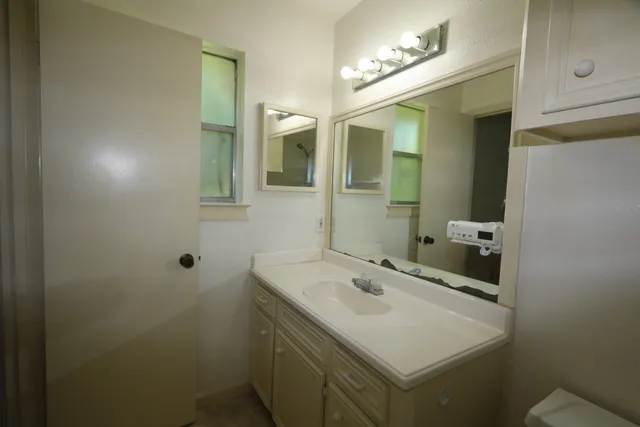 a bathroom with a sink and a mirror