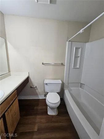 a bathroom with a toilet and a bathtub