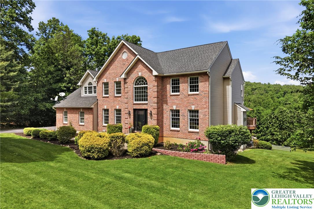 115 West Butternut Road Hellertown, PA 18055 - Photo 95 of 97 A classic brick exterior blends seamlessly with natural surroundings, creating a private haven.