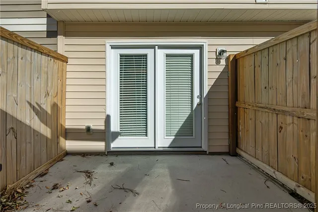 a view of a house with wooden walls