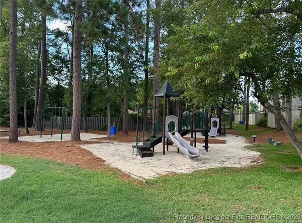a view of a park with basketball court