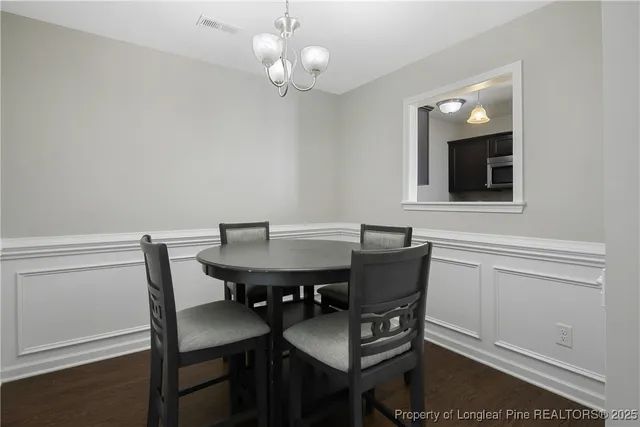 a view of a dining room with furniture